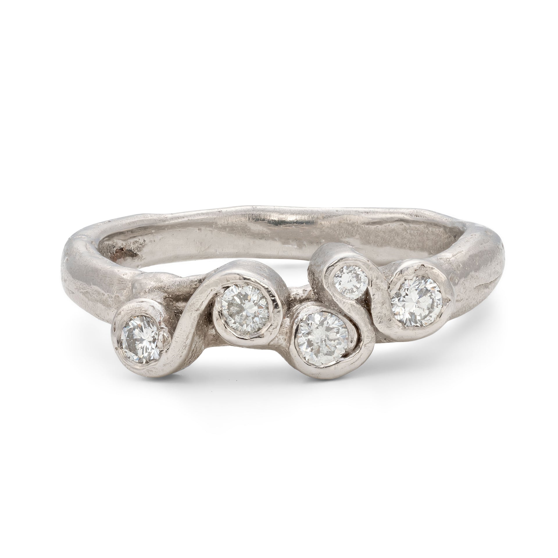 An all white platinum and diamond engagement ring. Created by Emily Nixon and cast using the lost wax process.