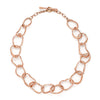Unconventional rose gold chain necklace by Cornwall jewellery designer Emily Nixon. Each irregular link has been handmade to vary in size. The solid 9ct gold retains a rich lustre without being overly shiny. The necklace can be worn at different lengths: neck choker or longer. Emily’s signature sea worn finish gives the impression of sea tumbled treasure, jewellery handmade in Cornwall, made tactile by the tide. 