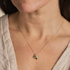 The Rift pendant featuring beautiful green sapphires embedded in 18ct gold. By Emily Nixon