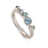 Ebb and flow ring with blue gemstones by Emily Nixon