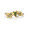 This Little Furbelow is set with stunning sea lettuce green sapphires in an 18ct yellow gold band. By Emily Nixon.