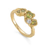 This Little Furbelow is set with stunning sea lettuce green sapphires in an 18ct yellow gold band. By Emily Nixon.