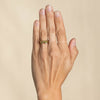 This Little Furbelow is set with stunning sea lettuce green sapphires in an 18ct yellow gold band. By Emily Nixon.
