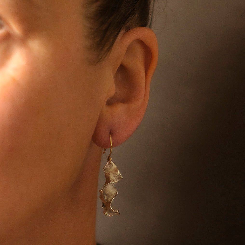 Silver organic drop earrings, handmade in Cornwall by Emily Nixon. Contemporary, mismatched character. 