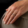 Blue sapphire and 18ct gold engagement ring, handmade by Emily Nixon. Photographed on a models hand.