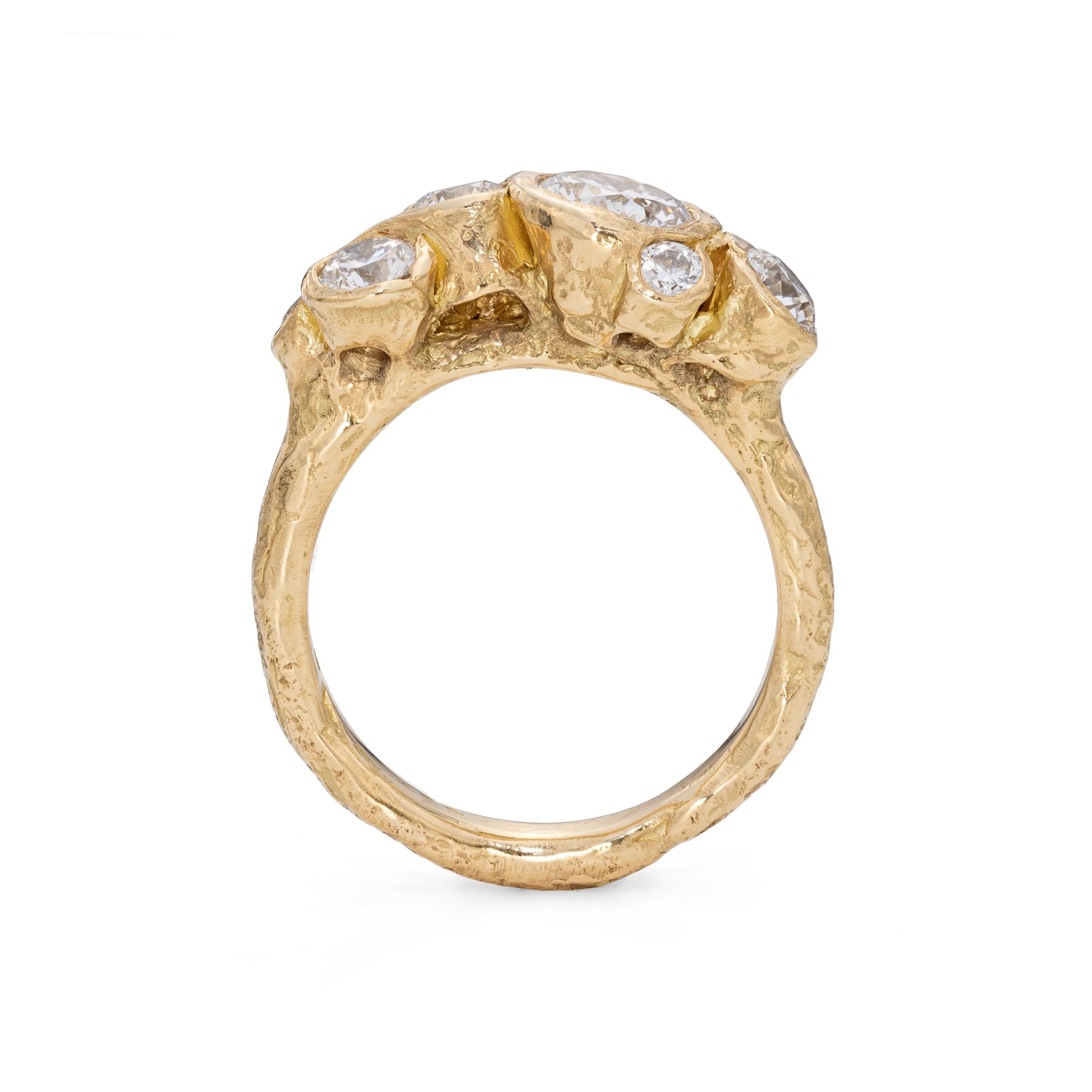 Side profile of an organic textured 18ct gold and diamond ring, handmade by Emily Nixon.