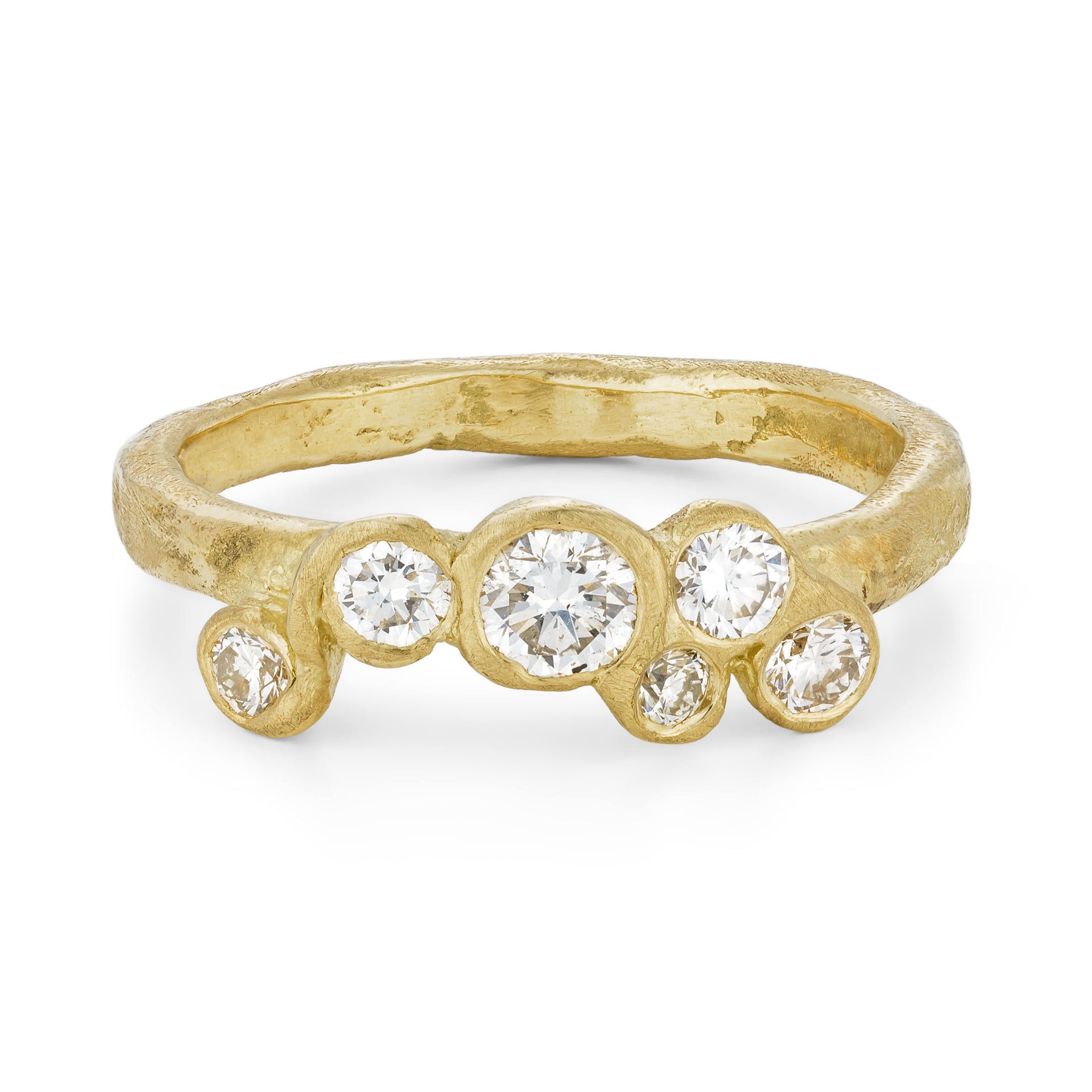 A unique and unusual 18ct gold engagement ring, set with 6 diamonds. This ring has a sea worn texture and has been handcrafted by Emily Nixon in Cornwall.