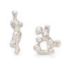 Mismatched silved stud earrings, inspired by the shapes of the sea. Created in Cornwall by Emily Nixon and traditionally cast.