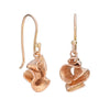 Sculptural earrings in 9ct rose gold, suspended on hand drawn 18ct gold wires. Made in Cornwall by Emily Nixon.
