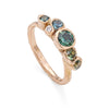 18ct rose gold ring with a collection of blue sapphires. Made in Cornwall by hand by Emily Nixon Jewellery.