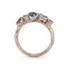 18ct white gold gemstone ring set with 5 blue sapphires and accent white diamond.