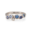 White gold gemstone ring with ocean blue sapphires.