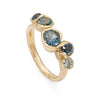 Yellow gold ring, organic form, with ethical teal sapphires.
