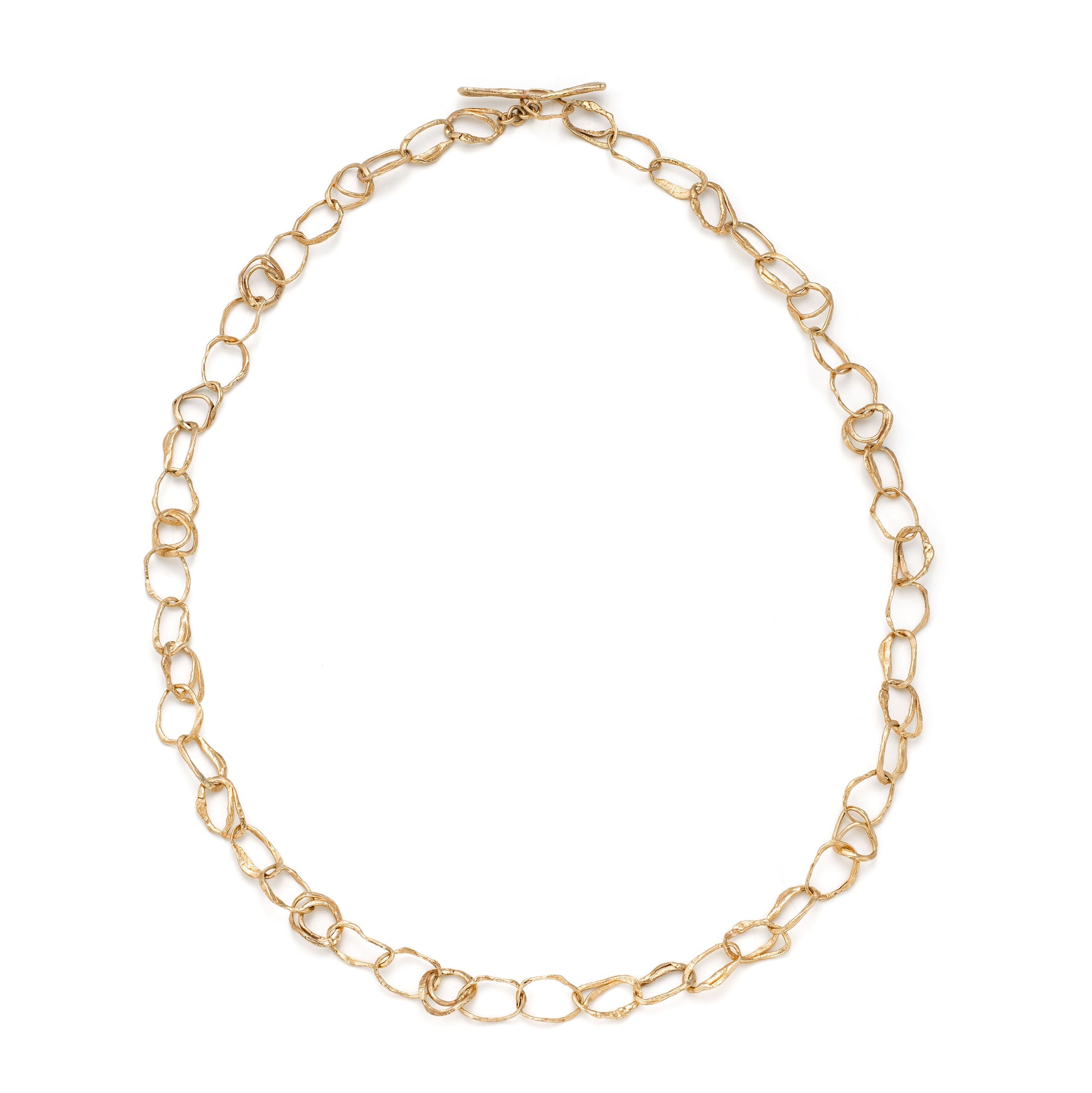 Contemporary jewellery necklace designed by Cornish jeweller Emily Nixon. Fine - approx 1cm across - irregular gold links are interconnected to create a long gold link chain. The style of Emily’s coastal jewellery is artful, organic and distinctly handmade. The links have been formed from small smoothed pebbles from Cornwall’s beaches creating the unusual, natural character of the necklace. Can be worn at long choker length 52cm or a medium length chain at 62cm. 