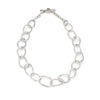 This unique, sculptural, large chain jewellery design is inspired and handmade on the coast of Cornwall. Individually made, chunky stone shaped links are deliberately different, creating a non uniform chain of irregular links. Unconventional with an arty style, this unusual silver necklace is intrinsically coastal and an Emily Nixon classic design. Finish is natural, the surface a sea worn, tumbled, tactile white silver. 