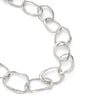 Close up detail of the hand crafted, irregular, solid silver links that make up the chain in Emily Nixon's Stone Drawing Necklace. Each link has been handmade to be different. The sterling silver retains a lustre without being overly shiny. Emily’s signature sea worn finish gives the impression of sea tumbled treasure, jewellery handmade in Cornwall, made tactile by the tide. 