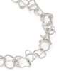 A line of 'tangled' organic links that moves freely. Handcrafted, solid silver T-bar finished with the a tumbled, sea-worn surface. By Emily Nixon.
