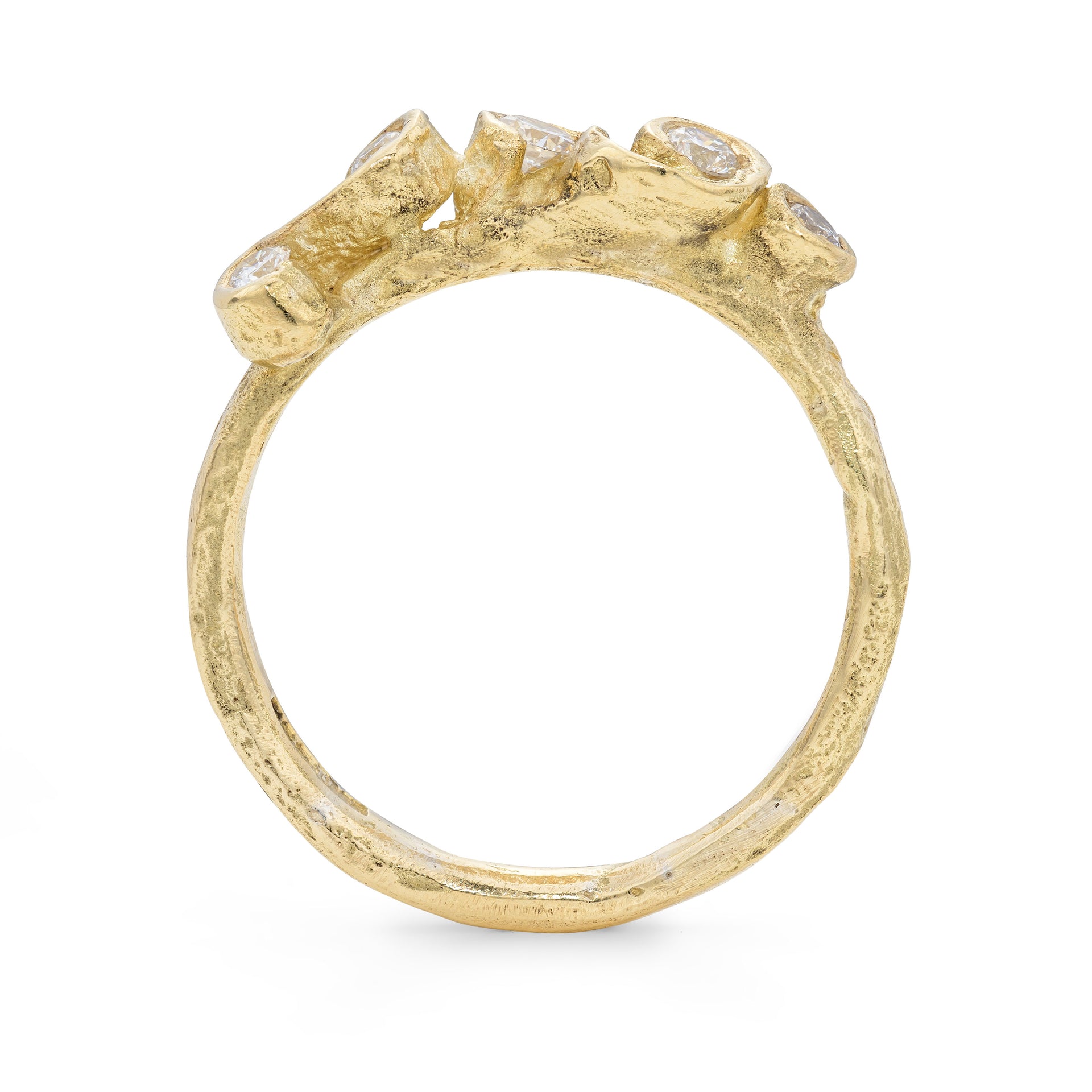 Side profile of an alternative, beach textured engagement ring, handcrafted by Emily Nixon.