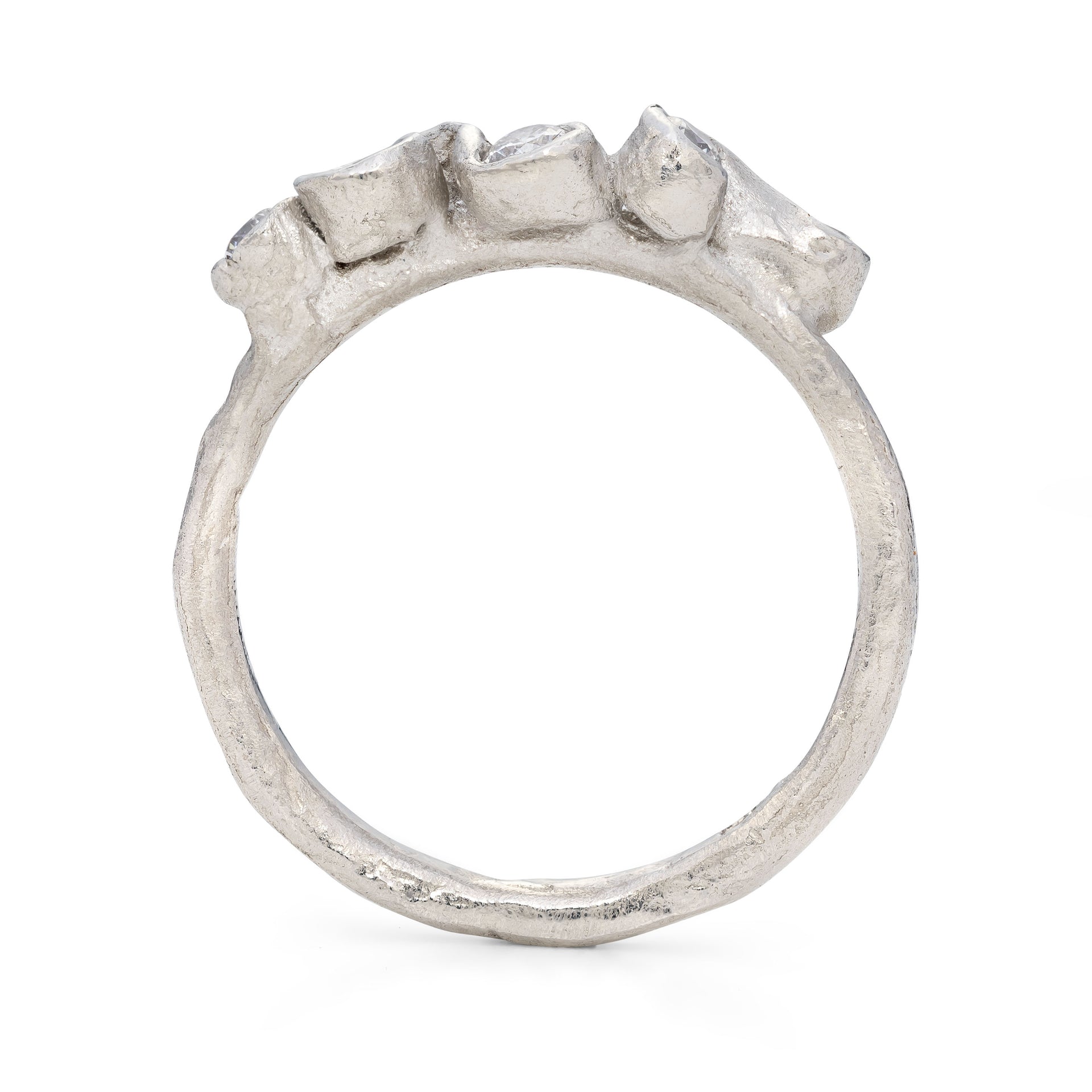 Upright, side view of platinum ring in organic design.