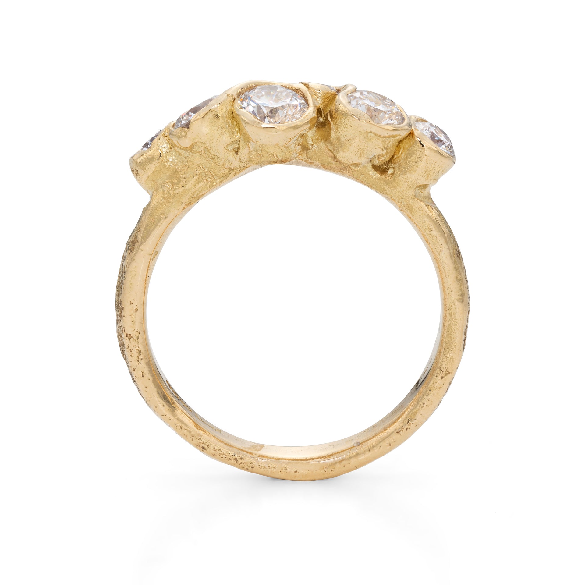Side profile of a unique, handmade engagement ring created by Emily Nixon, a Cornish jeweller.
