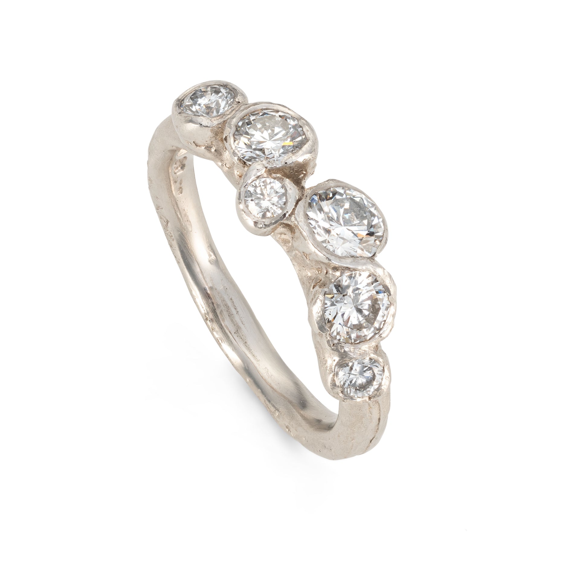 Upright view of a platinum engagement ring with 6 diamonds, created by Emily Nixon in Cornwall.